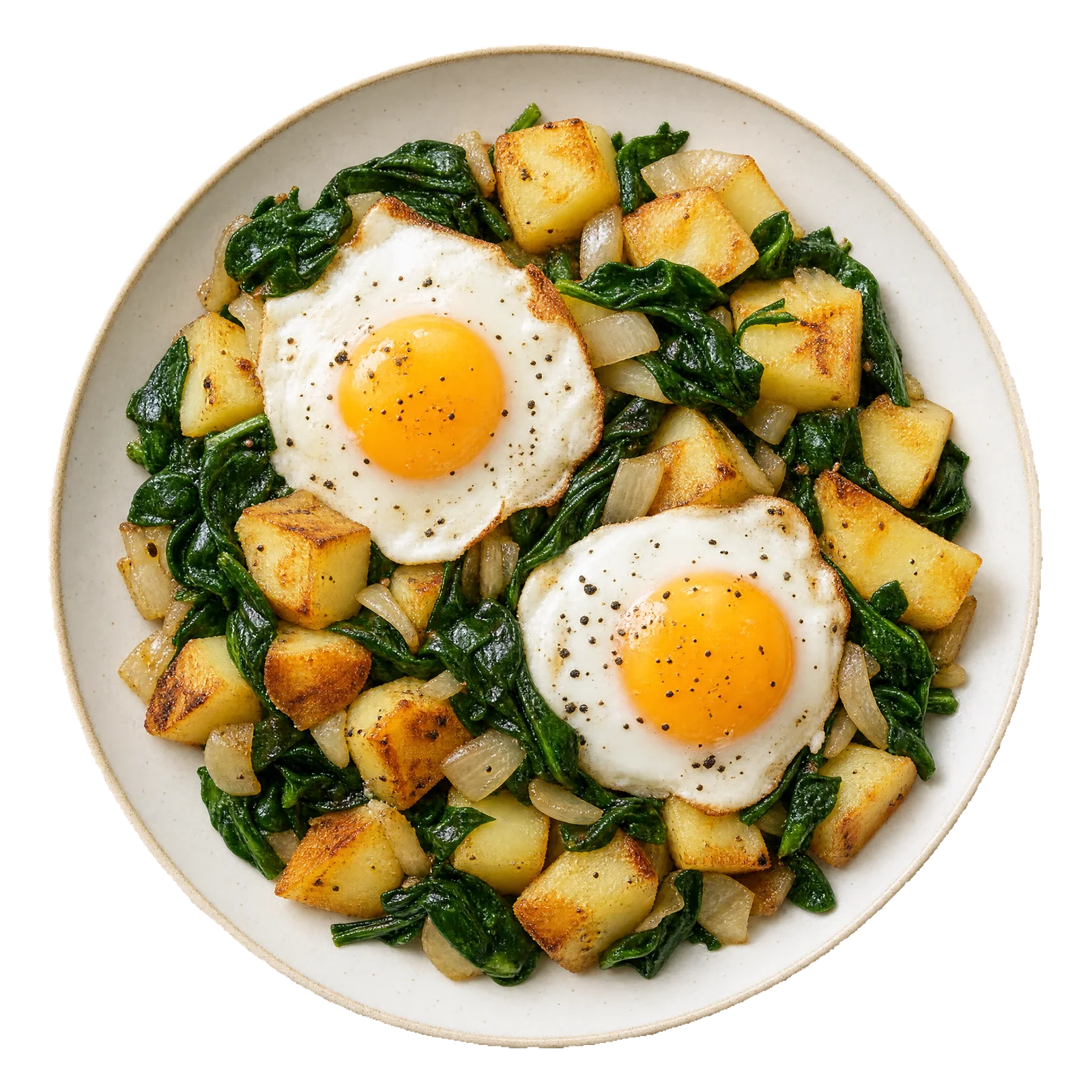 Golden potato cubes with spinach, onion and two eggs on a pale plate.